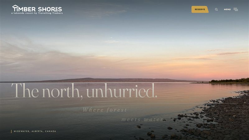 Timber Shores Resort homepage with 'The north, unhurried.' over a Lesser Slave Lake sunset